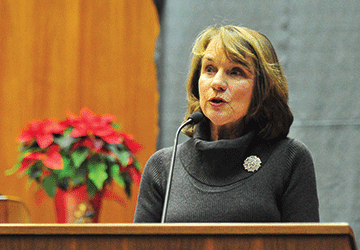 The Hon. David G. Larimer's wife, Karen Larimer, delivers remarks. Vasiliy Baziuk 